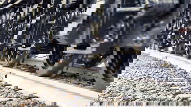 A photograph of railcar wheels on a track.