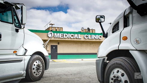 Trucks parked outside medical clinic.