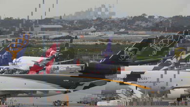 Cargo planes parked at busy airport