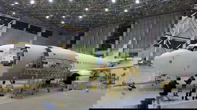 An older Boeing 737 gets ripped up in the shop and modified to carry cargo.