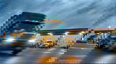 truck pulling out of fuel station