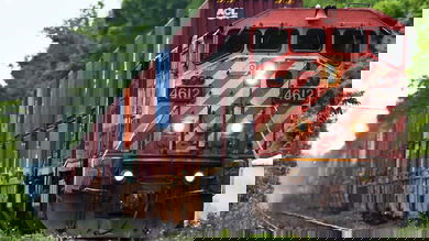 A photograph of a locomotive pulling railcars.