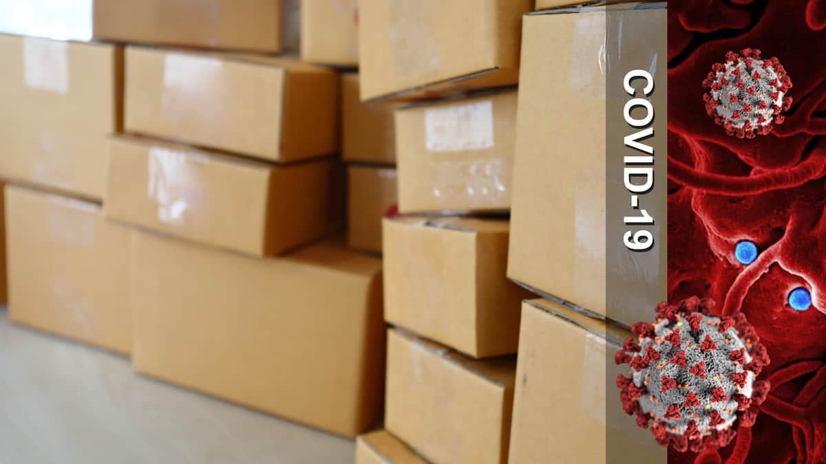 Boxes piled on top of each other + COVID-19 image.
