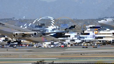 A big, white Lufthansa plane takes off