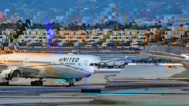 A white-and-blue United jet on the taxiway.
