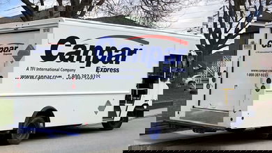 A van from TFI's Canpar stops for a delivery in Toronto, Canada,