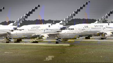White planes with blue tails on the tarmac.