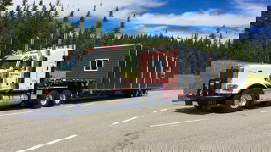An ENTREC tractor hauls an oversized load.