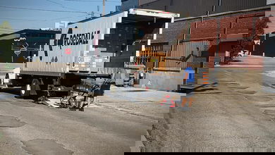 A driver unloads a truck in Toronto.