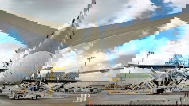 Flight preparations as viewed from behind and below the tail of a big jetliner.