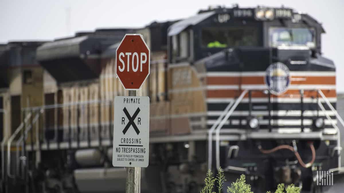 A train at a private railroad crossing.