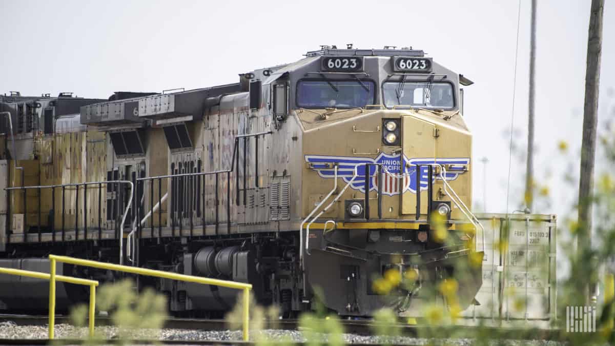 A long freight train pulled by at least two Union Pacific locomotives.