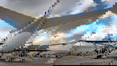 Cargo loading on a big jet as viewed from behind the tail, close up.