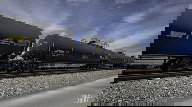 A photograph of tank cars parked at a rail yard.