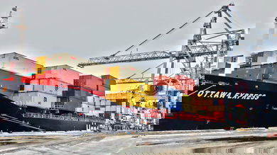 A container ship docked at the Port of Montreal. The port is expected to reopen on Sunday after an 11-day strike at the Port of Montreal