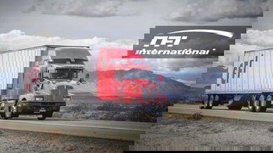 A tractor-trailer from TFI International-owned carrier CFI travels on a road. TFI raised nearly $219 million in a share offering, which could allow it to make additional acquisitions.