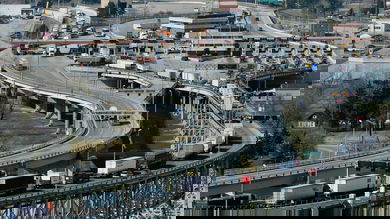 Trucks cross the the U.S.-Canada border. The US election could impact cross-border trade.