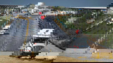 A view of trucks crossing the U.S.-Mexico border. Texas customs broker Daniel B. Hastings was recently targeted by ransomware hackers.