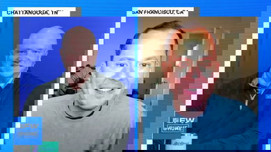 A screen shot of two men talking.