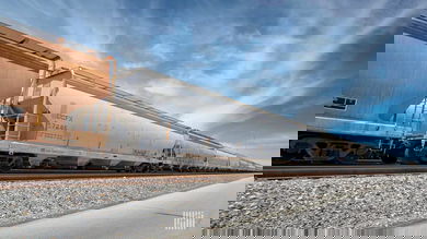 A photograph of hopper cars in a rail yard.