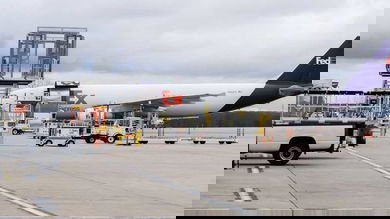 White FedEx cargo aircraft loaded with coronavirus vaccine in Michigan.