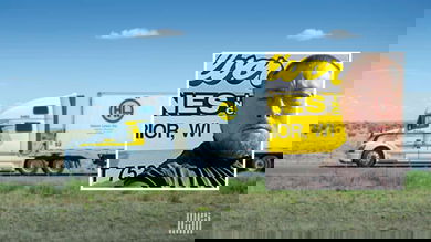 Halvor tractor-trailer heading down a highway (inlay: driver Joseph Brown)