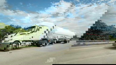 A white semi truck hauling a tanker trailer. Parkland Corp, major Canadian fuel distributor, was targeted in a cyberattack.