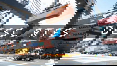 The logo of Descartes Systems Group on an image from a shipping container being loaded at a port.