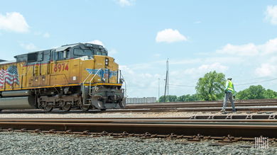 A photograph of a Union Pacific train on a train track.