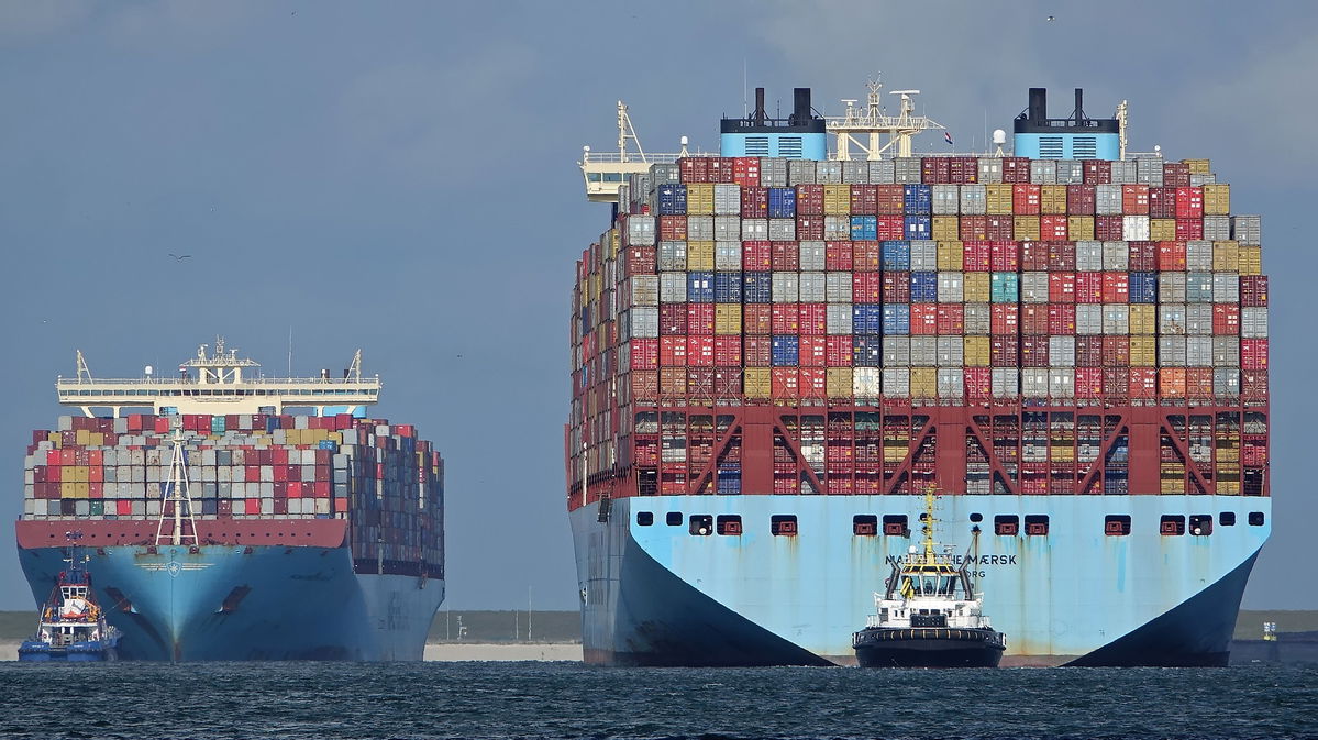 Two Maersk ships with containers stacked on them.