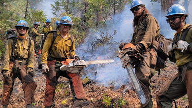 Crews at the Dixie fire in Northern California.