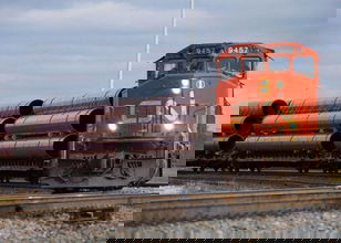 A photograph of a CN train hauling metals equipment.