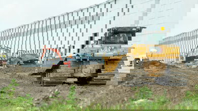 Construction equipment at the site of a logistics warehouse under construction