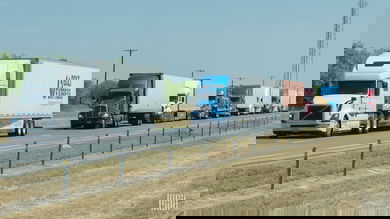Row of trucks along a stretch of highway