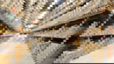 Defocused interior of warehouse aisle