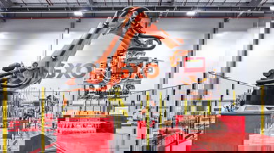 GXO robot arm in warehouse setting