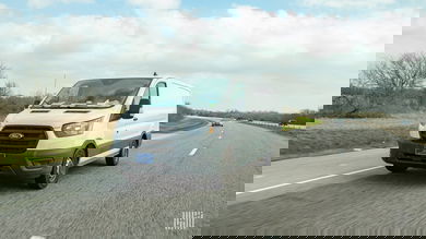 White delivery van on highway