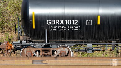 A tank car is parked on railroad track.