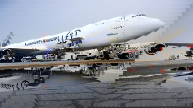 A Kuehne+Nagel jumbo jet freighter is loaded with cargo.