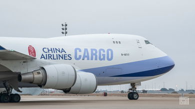 Front half of white/light blue China Airlines Cargo 747 jet on the ground.