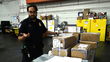 A U.S. Customs officer inspects mail shipments at JFK airport.