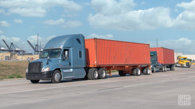 Tractors moving ocean containers near a port